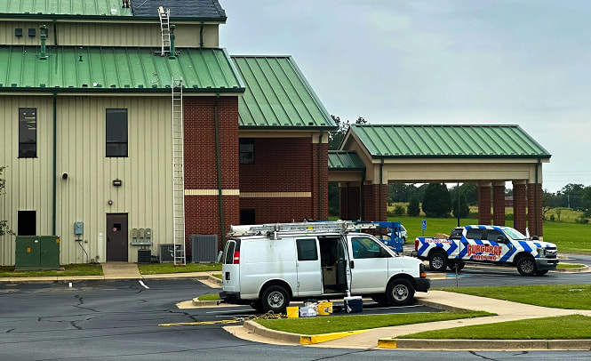 image 12 (1) ladder with Burggraf Roofing vehicle
